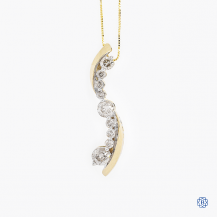  14k yellow gold chain, paired with a 10k yellow gold and diamond pendant